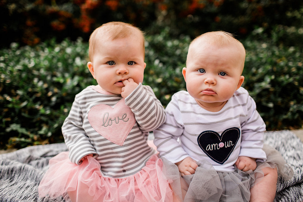 Twin Baby Girls wearing matching tutu dresses